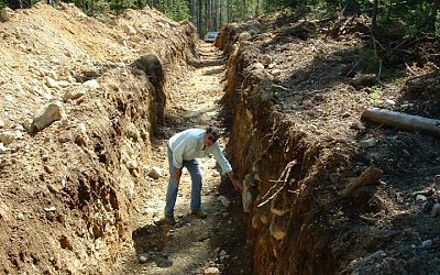 Saleken inspecting trench