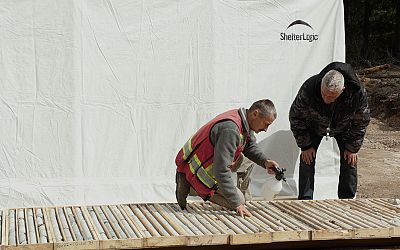 Project Manager Warner Gruenwald, P.Geo and property vendor Wayne Murton, P. Eng examining core